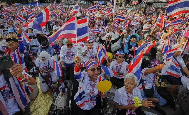 Protesters waving Thailand flags gather at Victory Monument demanding Prime Minister Paetongtarn Shinawatra resign in Bangkok, Thailand, Saturday, Aug. 2, 2025. (AP Photo/Tadchakorn Kitchaiphon)