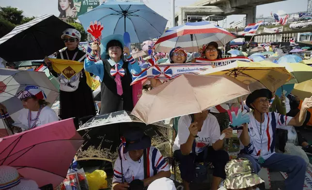 Protesters gather at Victory Monument demanding Thailand's Prime Minister Paetongtarn Shinawatra resign in Bangkok, Thailand, Saturday, Saturday, Aug. 2, 2025. (AP Photo/Tadchakorn Kitchaiphon)