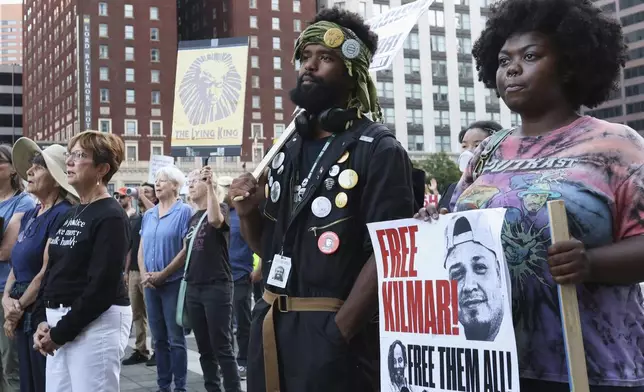 People attend a protest rally at the Immigration and Customs Enforcement field office in Baltimore, Monday, Aug. 25, 2025, to support Kilmar Abrego Garcia. (AP Photo/KT Kanazawich)