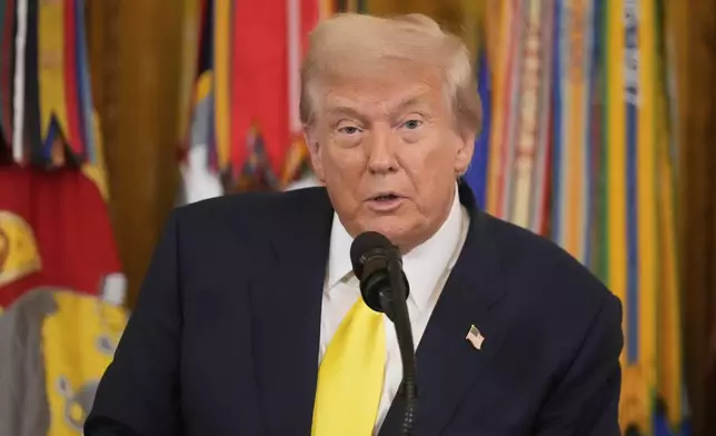 President Donald Trump speaks at an event to mark National Purple Heart Day in the East Room of the White House, Thursday, Aug. 7, 2025, in Washington. (AP Photo/Mark Schiefelbein)