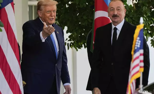 President Donald Trump greets Azerbaijan's President Ilham Aliyev at the White House, Friday, Aug. 8, 2025, in Washington. (AP Photo/Julia Demaree Nikhinson)