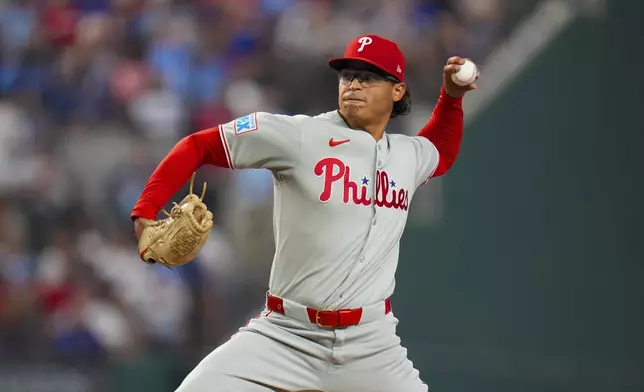 Philadelphia Phillies starting pitcher Jesús Luzardo throws to the Texas Rangers during the first inning of a baseball game Saturday, Aug. 9, 2025, in Arlington, Texas. (AP Photo/Julio Cortez)