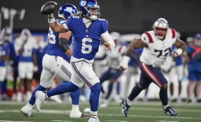 New York Giants quarterback Jaxson Dart (6) passes the ball against the New England Patriots during the first quarter of an NFL football game, Thursday, Aug. 21, 2025, in East Rutherford, N.J. (AP Photo/Frank Franklin II)