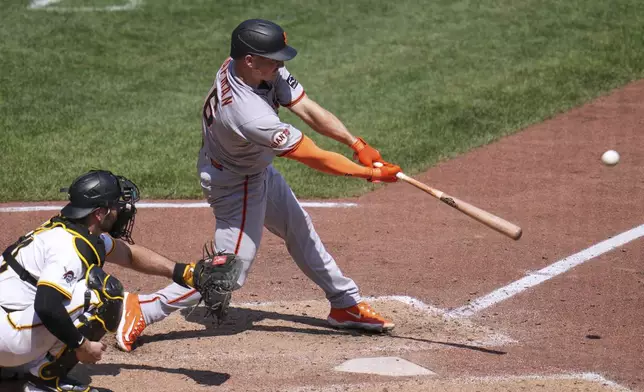 San Francisco Giants' Matt Chapman drives in a run with a sacrifice fly off Pittsburgh Pirates pitcher Dennis Santana during the eighth inning of a baseball game in Pittsburgh, Wednesday, Aug. 6, 2025. (AP Photo/Gene J. Puskar)