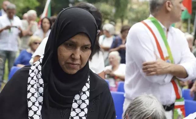 The mother of 19-year-old Palestinian woman Marah Abu Zhuri attends her funeral in Pontesserchio, near Pisa, Italy, Wednesday Aug. 20, 2025, who died there after being evacuated from Gaza. (Alessandro La Rocca/LaPresse via AP)