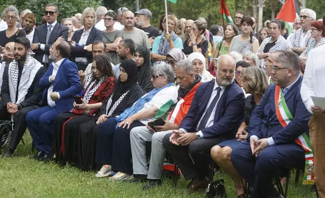 The mother, front center, of 19-year-old Palestinian woman Marah Abu Zhuri attends her funeral in Pontesserchio, near Pisa, Italy, Wednesday Aug. 20, 2025, who died there after being evacuated from Gaza. (Alessandro La Rocca/LaPresse via AP)