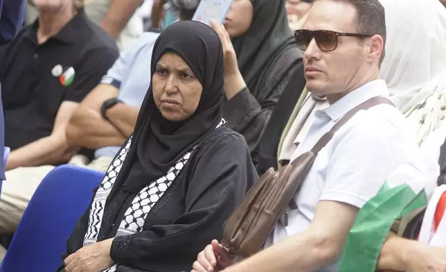 The mother of 19-year-old Palestinian woman Marah Abu Zhuri attends her funeral in Pontesserchio, near Pisa, Italy, Wednesday Aug. 20, 2025, who died there after being evacuated from Gaza. (Alessandro La Rocca/LaPresse via AP)