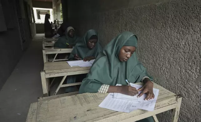 Students of the Future Prowess Islamic Foundation School take a terminal exam, in Maiduguri, Nigeria, Thursday, July 24, 2025. (AP Photo/Sunday Alamba)