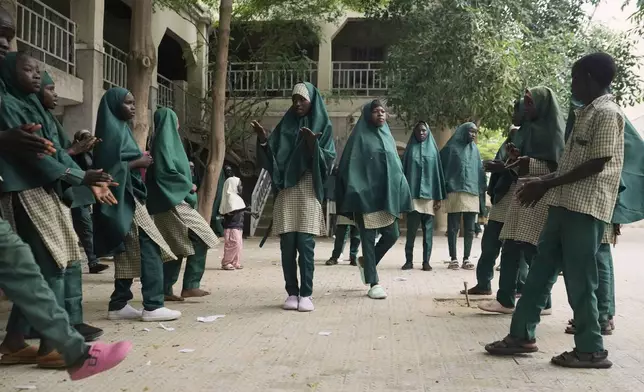 Students of the Future Prowess Islamic Foundation School perform a traditional dance, in Maiduguri, Nigeria, Thursday, July 24, 2025. (AP Photo/Sunday Alamba)