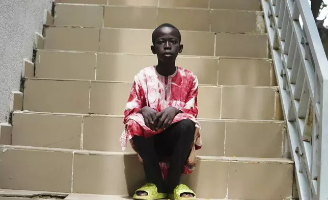 Israel Peter, who fled his village following an attack by Boko Haram Islamic extremists, waits to be interviewed by The Associated Press, at the Future Prowess Islamic Foundation School in Maiduguri, Nigeria, Thursday, July 24, 2025. (AP Photo/Sunday Alamba)