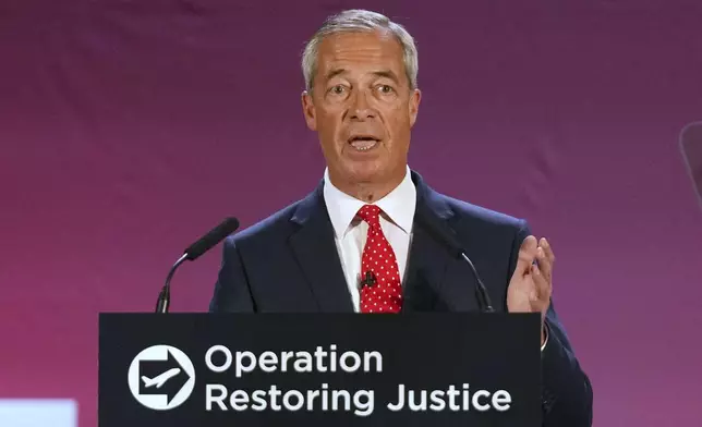 British Reform party leader Nigel Farage addresses journalists during a press conference in a hangar at Oxford Airport in Kidlington, England, Tuesday, Aug. 26, 2025.(AP Photo/Joanna Chan)