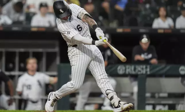 Chicago White Sox's Korey Lee (26) hits a two-run home run during the fourth inning of a baseball game against the Kansas City Royals, Monday, Aug. 25, 2025, in Chicago. (AP Photo/Erin Hooley)