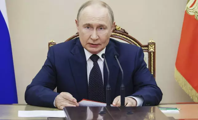 Russian President Vladimir Putin chairs the Security Council meeting at the Kremlin in Moscow, Russia, Friday, Aug. 8, 2025. (Mikhail Metzel, Sputnik, Kremlin Pool Photo via AP)