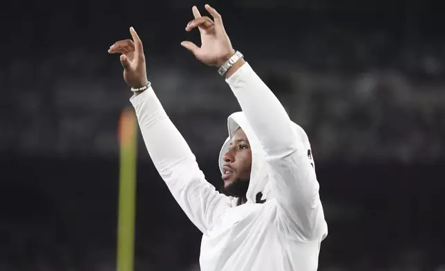 Philadelphia Eagles running back Saquon Barkley reacts in the second half of a preseason NFL football game against the New York Jets in East Rutherford, N.J., Friday, Aug. 22, 2025. (AP Photo/Frank Franklin)