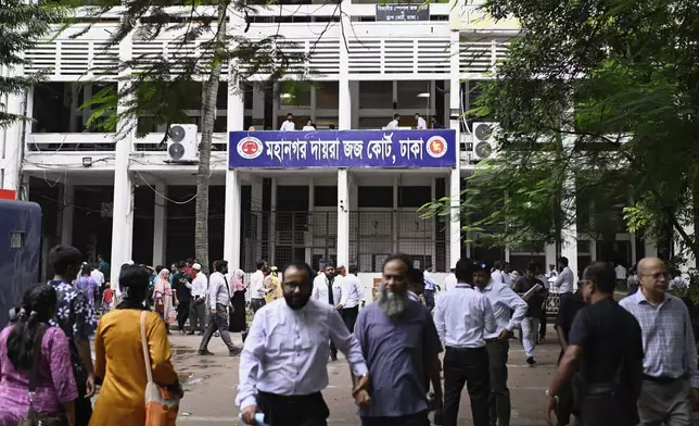 People are seen in the compound of the Metropolitan Sessions Judge Court in Dhaka, Bangladesh, Wednesday, Aug. 13, 2025. (AP Photo/Mahmud Hossain Opu)