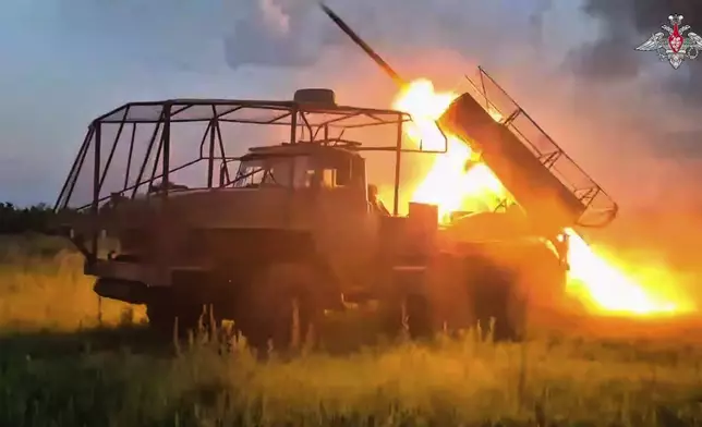 In this photo taken from video distributed by Russian Defense Ministry Press Service on Monday, Aug. 25, 2025, a Russian Army BM-21 "Grad" self-propelled multiple rocket launcher fires towards Ukrainian position in an undisclosed location in Ukraine. (Russian Defense Ministry Press Service via AP)