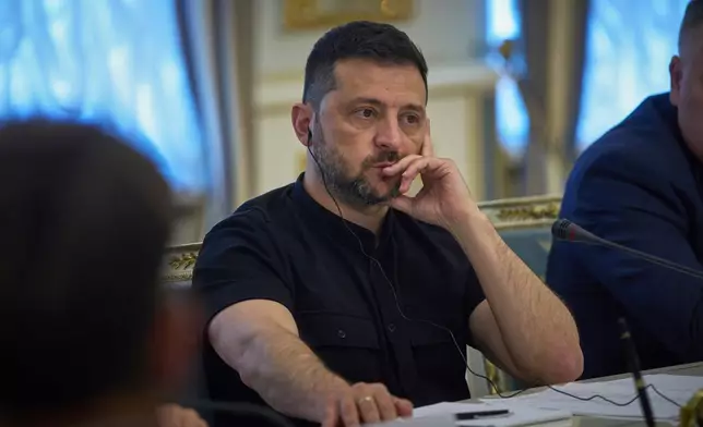 Ukrainian President Volodymyr Zelenskyy listens to German Vice Chancellor and Finance Minister Lars Klingbeil during their meeting in Kyiv, Ukraine, Monday, Aug. 25, 2025. (AP Photo/Efrem Lukatsky)