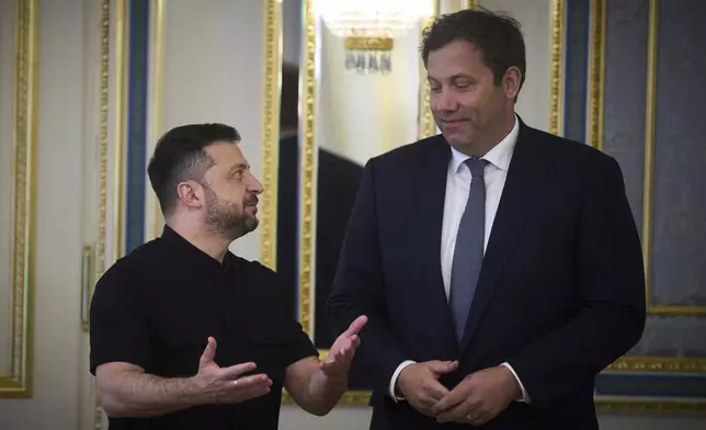 German Vice Chancellor and Finance Minister Lars Klingbeil, right, and Ukrainian President Volodymyr Zelenskyy talk during their meeting in Kyiv, Ukraine, Monday, Aug. 25, 2025. (AP Photo/Efrem Lukatsky)