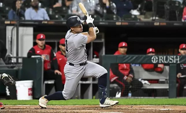 New York Yankees' Anthony Volpe hits an RBI single during the sixth inning of a baseball game against the Chicago White Sox, Friday, Aug. 29, 2025, in Chicago. (AP Photo/Matt Marton)