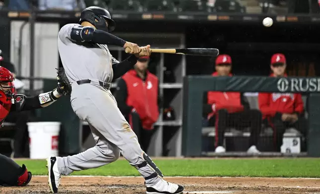 New York Yankees' Trent Grisham hits a grand slam during the fourth inning of a baseball game against the Chicago White Sox, Friday, Aug. 29, 2025, in Chicago. (AP Photo/Matt Marton)