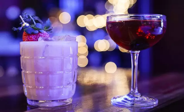 FILE - Mixed drinks are displayed at a bar in Baltimore, Feb. 8, 2023. (AP Photo/Julio Cortez, File)