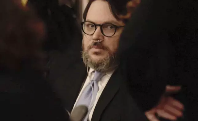 In this image made from pool video footage, Nicholas Rossi accused of faking his death and fleeing to Europe to avoid rape charges, appears at a jury trial in Salt Lake City, Monday, Aug. 11, 2025. (Firecrest Films via AP, Pool)