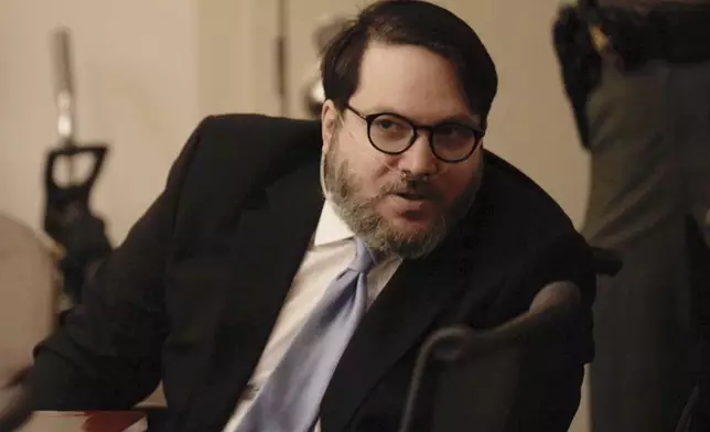 In this image made from pool video footage, Nicholas Rossi accused of faking his death and fleeing to Europe to avoid rape charges, appears at a jury trial in Salt Lake City, Monday, Aug. 11, 2025. (Firecrest Films via AP, Pool)