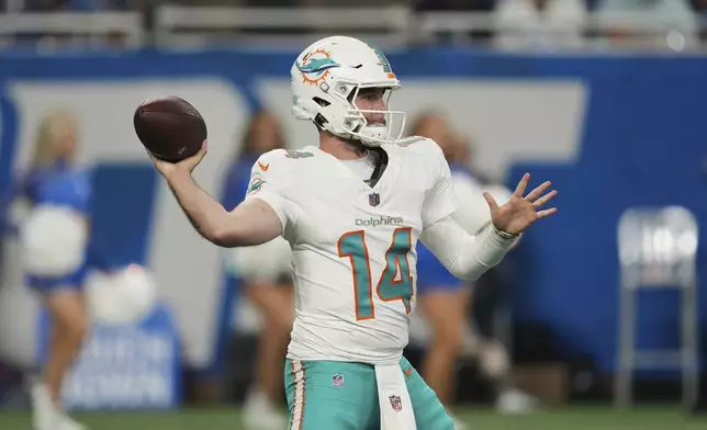 Miami Dolphins quarterback Quinn Ewers (14) passes during the second half of an NFL preseason football game against the Detroit Lions Saturday, Aug. 16, 2025, in Detroit. (AP Photo/Paul Sancya)