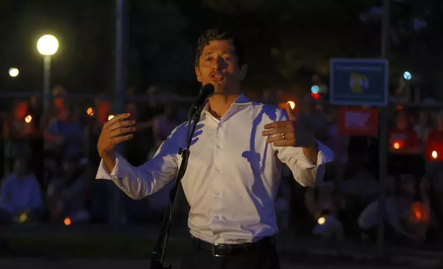 Minneapolis Mayor Jacob Frey speaks as people gather at a vigil at Lynnhurst Park after a shooting at the Annunciation Catholic School Wednesday, Aug. 27, 2025, in Minneapolis. (AP Photo/Bruce Kluckhohn)