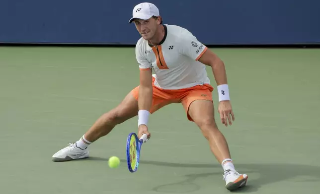 Casper Ruud, of Norway, returns a shot to Raphael Collignon, of Belgium, during the second round of the U.S. Open tennis championships, Wednesday, Aug. 27, 2025, in New York. (AP Photo/Andres Kudacki)