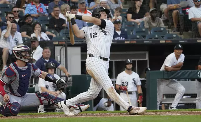 Chicago White Sox's Colson Montgomery hits a grand slam against the Minnesota Twins during the second inning of a baseball game Saturday, August 23, 2025, in Chicago. (AP Photo/David Banks)