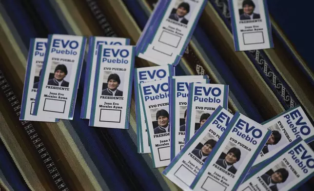 Stickers of former President Evo Morales sit on a table at a campaign center for supporters in favor of a null vote in the upcoming presidential elections in El Alto, Bolivia, Tuesday, Aug. 12, 2025. (AP Photo/Natacha Pisarenko)