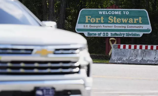 A sign welcoming people to Fort Stewart in Georgia is seen on Wednesday, Aug. 6, 2025. (AP Photo/Mike Stewart)