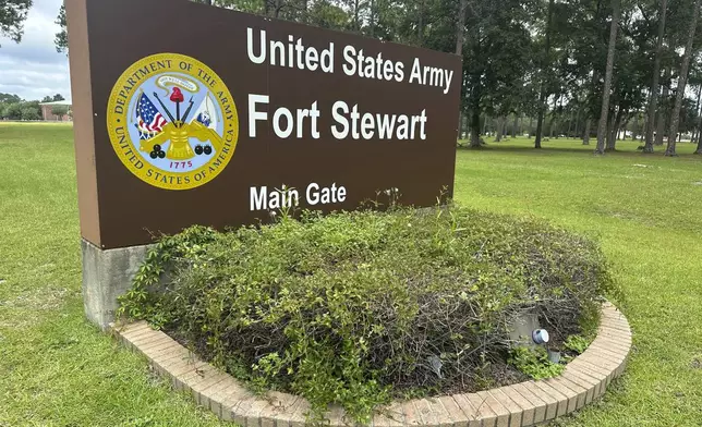 A sign outside the main gate of Fort Stewart, Georgia, is shown on Wednesday, Aug. 6, 2025. (AP Photo/Russ Bynum)