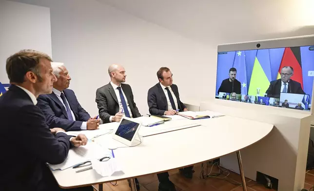 French President Emmanuel Macron, left, Antonio Costa, President of the European Council, second left, French Foreign Minister Jean-Noel Barrot, third right, and French Defense Minister Sebastien Lecornu, attend a video conference on Ukraine at the Fort de Bregancon in Bormes-les-Mimosas, southern France, Wednesday Aug.13, 2025. (Philippe Magoni, Pool via AP)