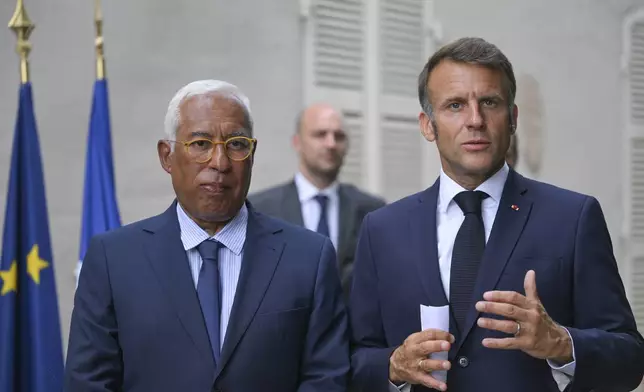 French President Emmanuel Macron, right, and Antonio Costa, President of the European Council, attend a statement following a video conference on Ukraine at the Fort de Bregancon in Bormes-les-Mimosas, southern France, Wednesday Aug.13, 2025. (Philippe Magoni, Pool via AP)