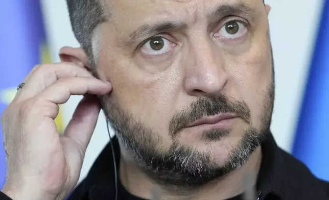 Ukrainian President Volodymyr Zelenskyy attends a joint press statement with German Chancellor Friedrich Merz following talks with European and U.S. leaders in Berlin, Germany, Wednesday, Aug. 13, 2025. (AP Photo/Ebrahim Noroozi)