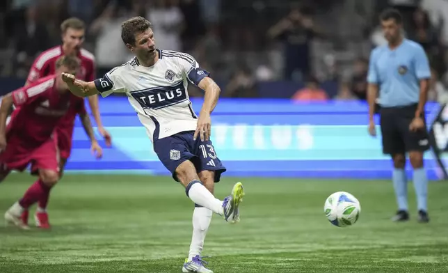 Vancouver Whitecaps Thomas Muller scores the winning goal on a penalty kick against St. Louis City during the second half of an MLS soccer match, in Vancouver, British Columbia, Saturday, Aug. 23, 2025. (Darryl Dyck/The Canadian Press via AP)