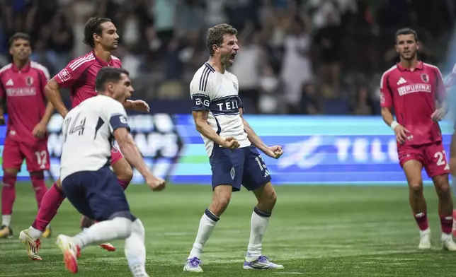Vancouver Whitecaps Thomas Muller, centrer, celebrates his winning penalty kick goal against St. Louis City during the second half of an MLS soccer match, in Vancouver, British Columbia, Saturday, Aug. 23, 2025. (Darryl Dyck/The Canadian Press via AP)
