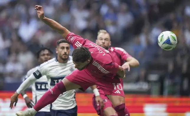 St. Louis City's Eduard Lowen gets his head on the ball and scores against the Vancouver Whitecaps during the first half of an MLS soccer match, in Vancouver, on Saturday, August 23, 2025. (Darryl Dyck/The Canadian Press via AP)