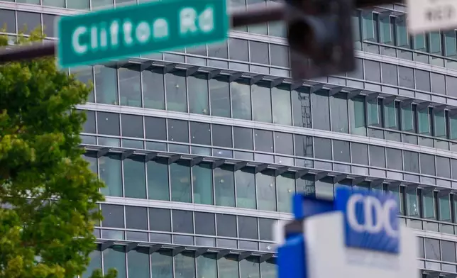 The notable bullet marks on the windows of the Centers for Disease Control and Prevention headquarters are visible on Sunday Aug. 10, 2025. (Miguel Martinez/Atlanta Journal-Constitution via AP)
