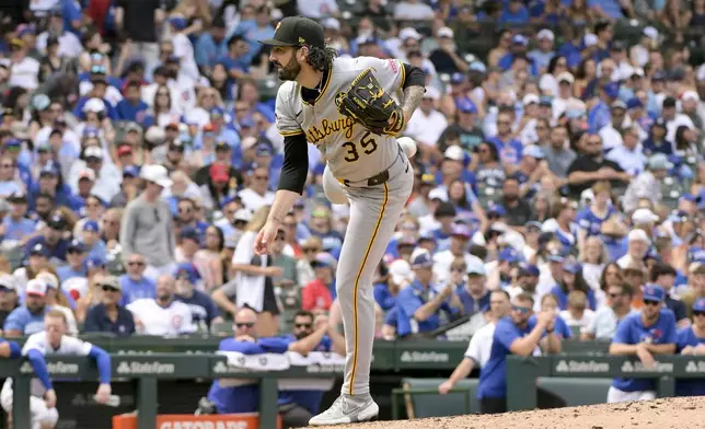 Pittsburgh Pirates pitcher Colin Holderman throws against the Chicago Cubs during the sixth inning of a baseball game, Sunday, Aug. 17, 2025, at Wrigley Field in Chicago. (AP Photo/Mark Black)