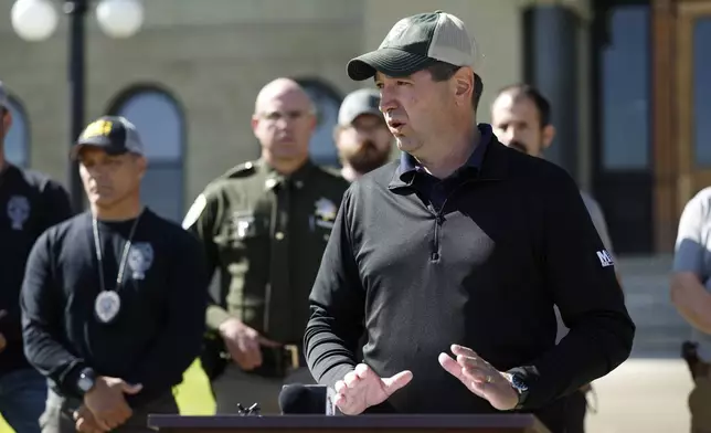 Montana Attorney General Austin Knudsen speaks to the media Sunday, Aug. 3, 2025 in front of the Anaconda-Deer Lodge County Courthouse in Anaconda, Mont., about the ongoing search for shooting suspect Michael Brown. (Joseph Scheller/The Montana Standard via AP)