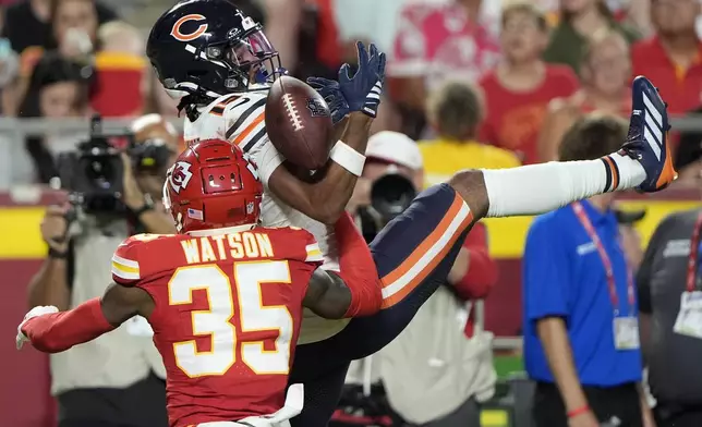 Chicago Bears wide receiver Rome Odunze is unable to catch a pass as Kansas City Chiefs cornerback Jaylen Watson (35) defends during the first half of a preseason NFL football game Friday, Aug. 22, 2025, in Kansas City, Mo. (AP Photo/Charlie Riedel)
