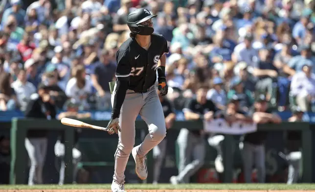 Chicago White Sox's Brooks Baldwin watches his home run off Seattle Mariners pitcher Carlos Vargas during the seventh inning of a baseball game, Thursday, Aug. 7, 2025, in Seattle. (AP Photo/Jason Redmond)