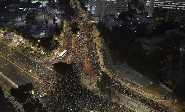 People take part in a protest demanding the immediate release of all hostages held by Hamas and calling for the end of the war in the Gaza Strip, in Tel Aviv, Israel, Tuesday, Aug. 26, 2025. (AP Photo/Ohad Zwigenberg)