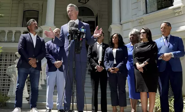 FILE - California Gov. Gavin Newsom, accompanied by several members of the Texas state Legislature, calls for a new way for California to redraw its voting districts, during a news conference In Sacramento, Calif., Friday July 25, 2025. (AP Photo by Rich Pedroncelli,File)