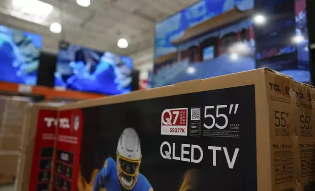 New televisions are displayed for sale at a store in Kennesaw, Ga., on Thursday, Aug. 14, 2025. (AP Photo/Mike Stewart)