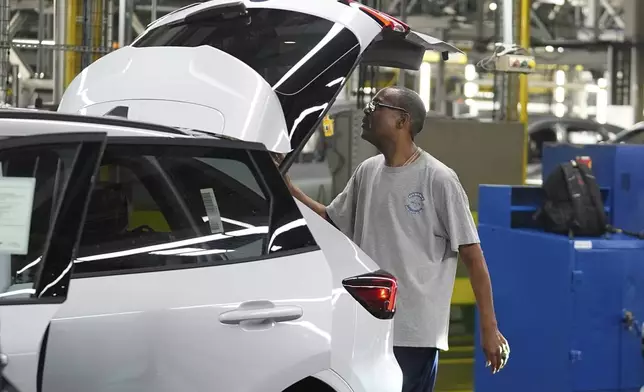 A Ford vehicle is shown on the assembly line at the Ford Louisville Assembly Plant, Monday, Aug. 11, 2025, in Louisville, Ky. (AP Photo/Darron Cummings)