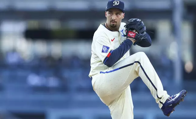 Los Angeles Dodgers pitcher Blake Snell prepares to throw to a Toronto Blue Jays batter during the first inning of a baseball game, Saturday, Aug. 9, 2025, in Los Angeles. (AP Photo/Jessie Alcheh)